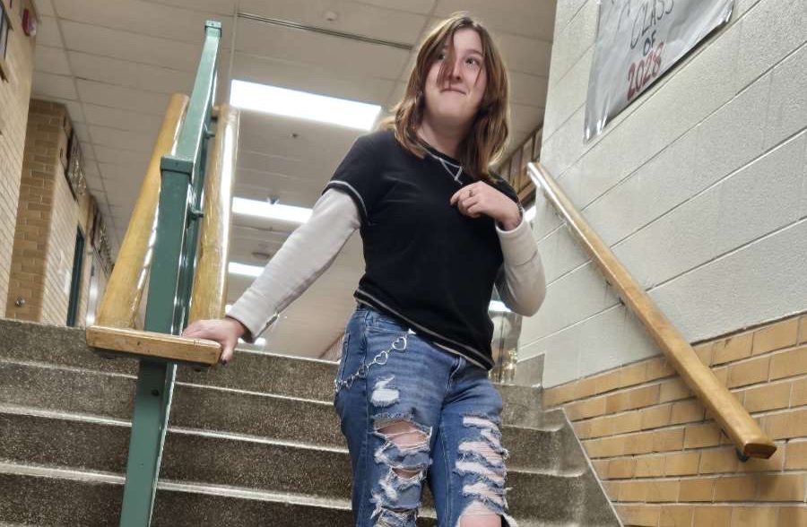 Senior Alex Tatroe shows up in ripped jeans to enforce the dress code.