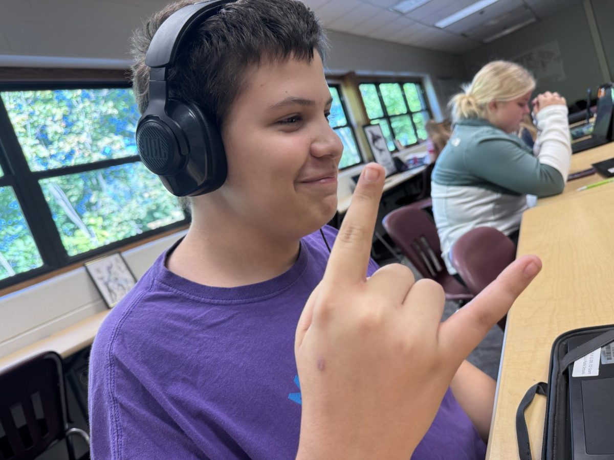 Sophomore Keegan Contreras rocks out to his music.