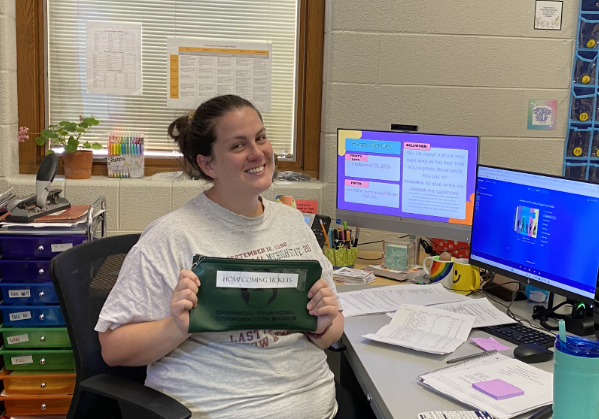 Mrs. Kaiser proudly showcases Homecoming ticket sale progress.