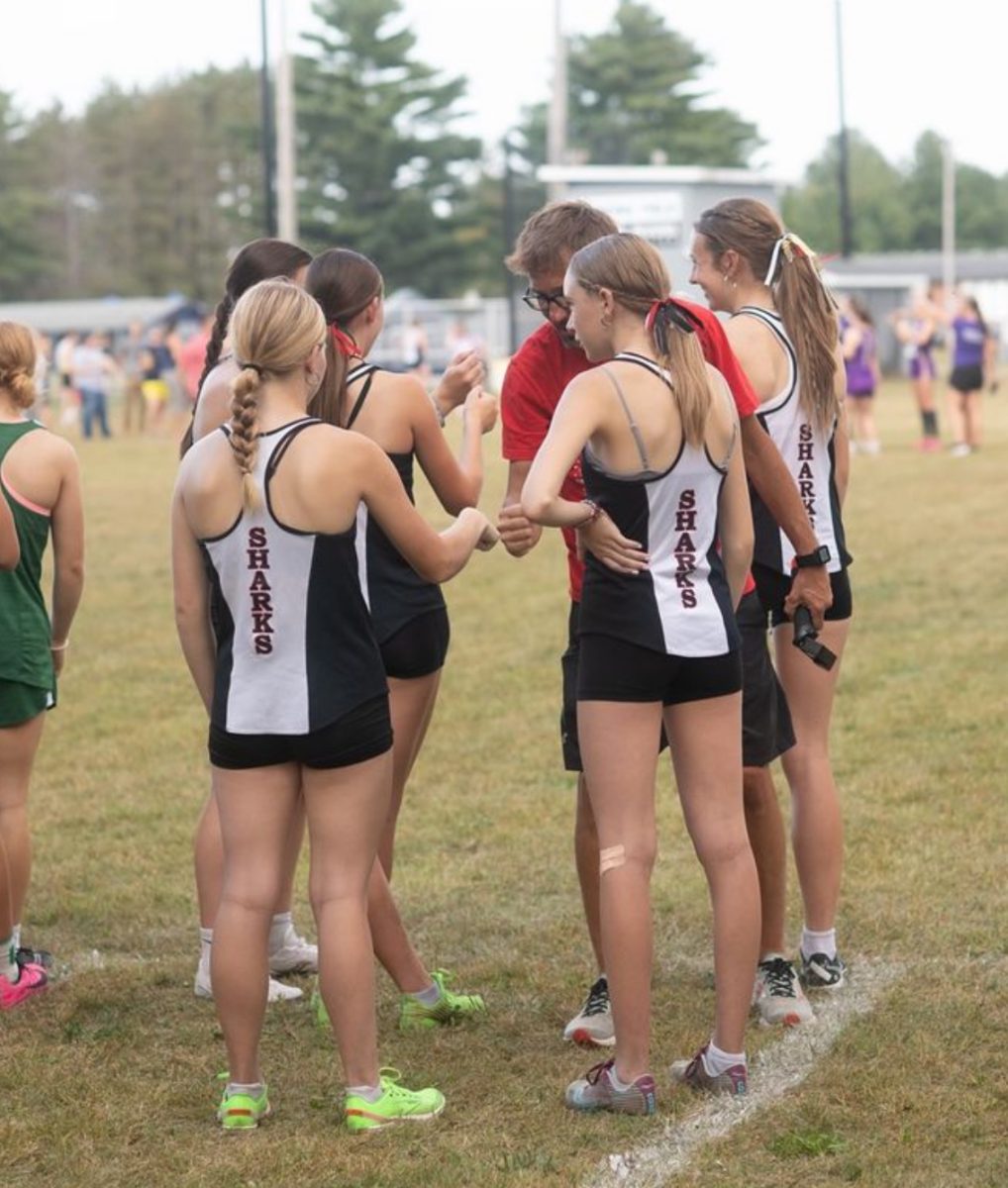 The girls huddled up, making a plan on what to do.