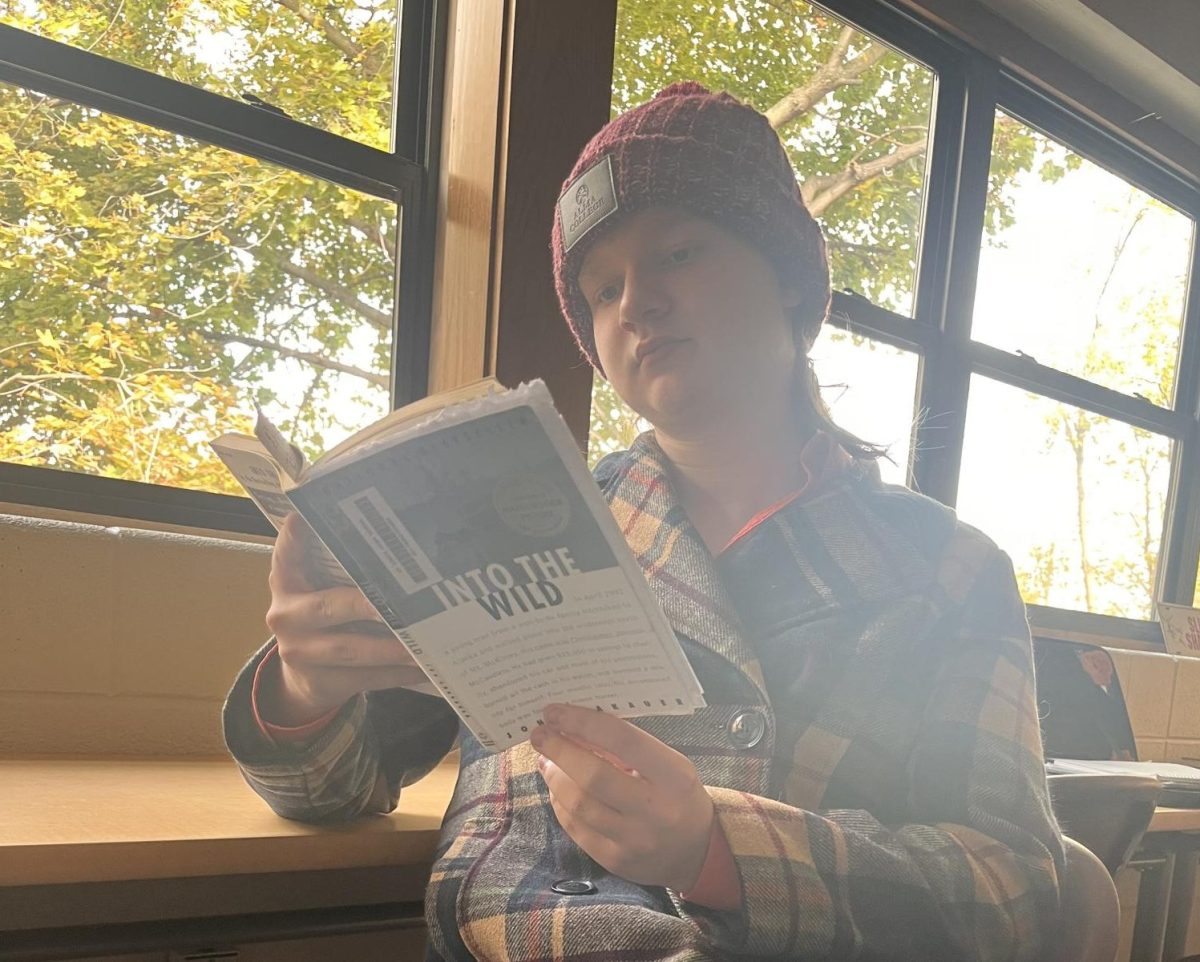 Junior Jake Elsea reads a book featured in his English class.