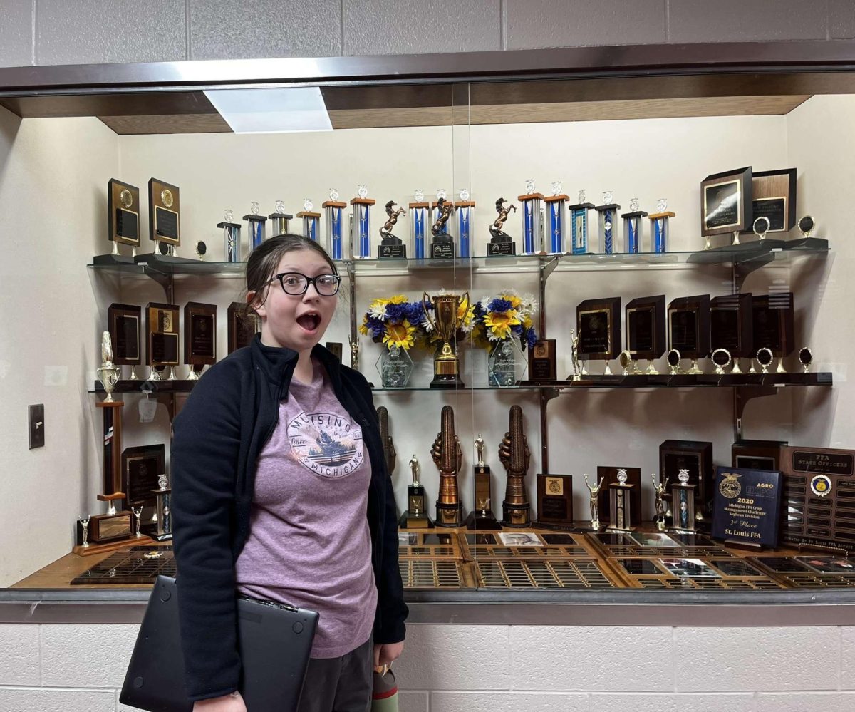 Junior Sophia Miller is in amaze of the array of trophies!