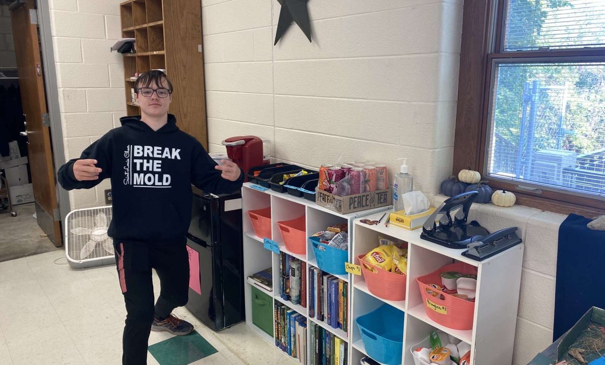 Bryce Buchanan poses near the snack stash in the AG room.