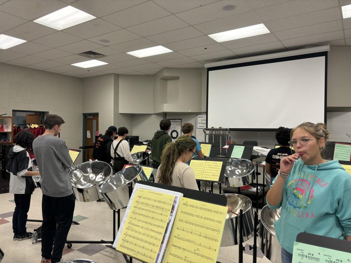 After-school steel band members practice learning a new Green Day song.