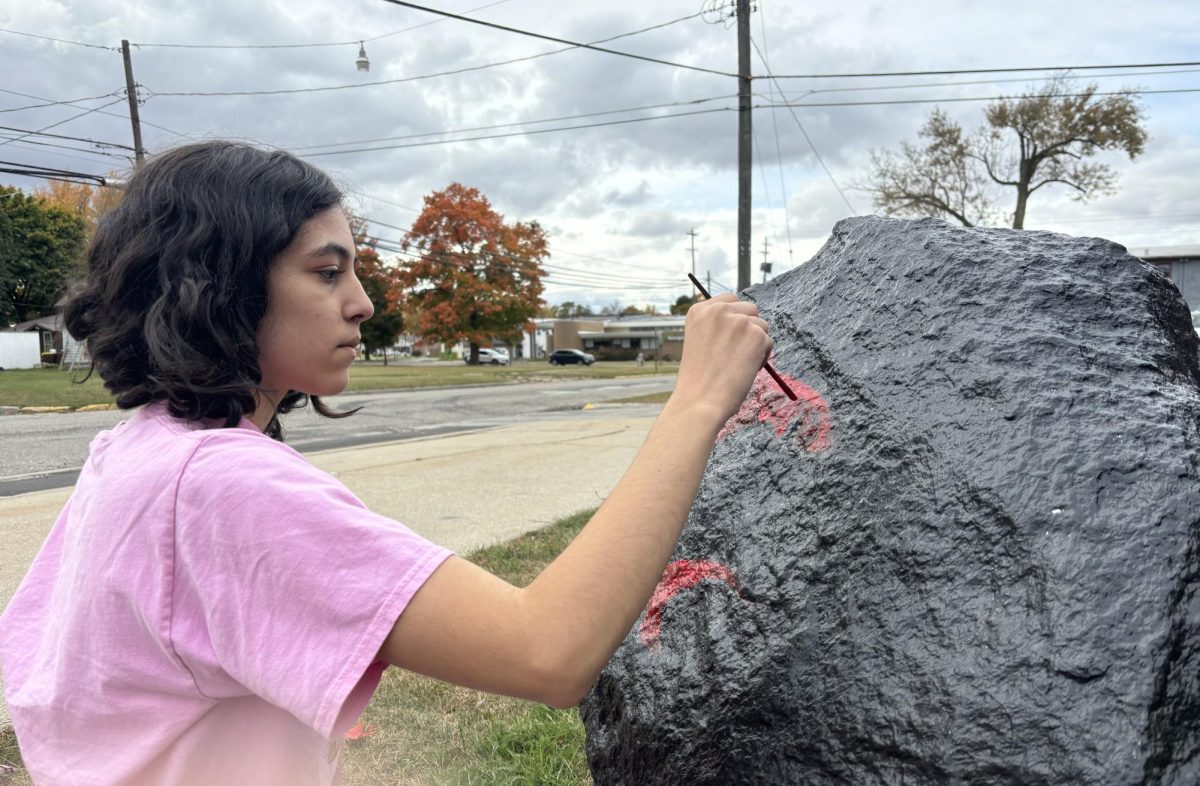 Senior Kaya Munoz works hard at making the spirit rock one to remember for the senior class of 2025!