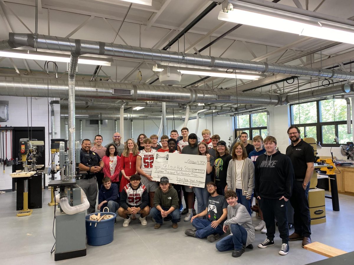 Mr. Maxwell's check with all the woodshop students!