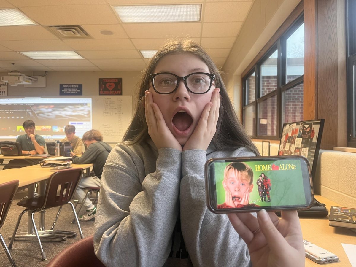 Junior Sophia Miller reenacts an iconic scene from Home Alone.