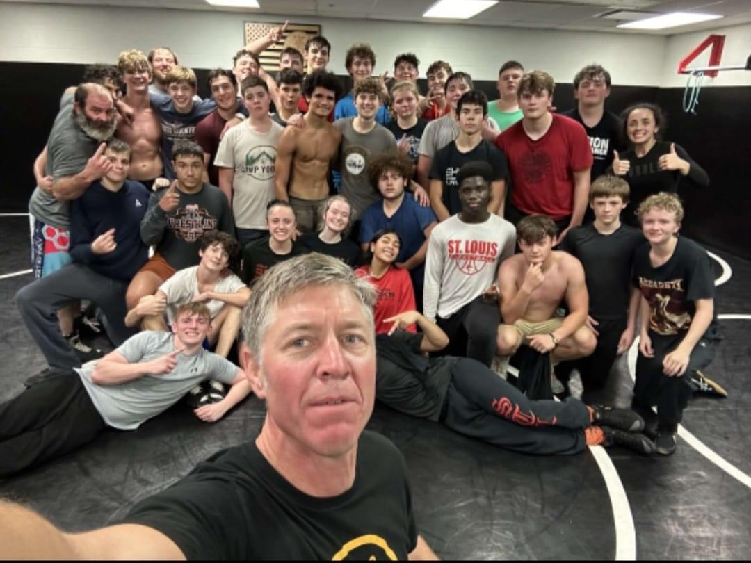 The wrestling team takes a photo after their first practice of the season!