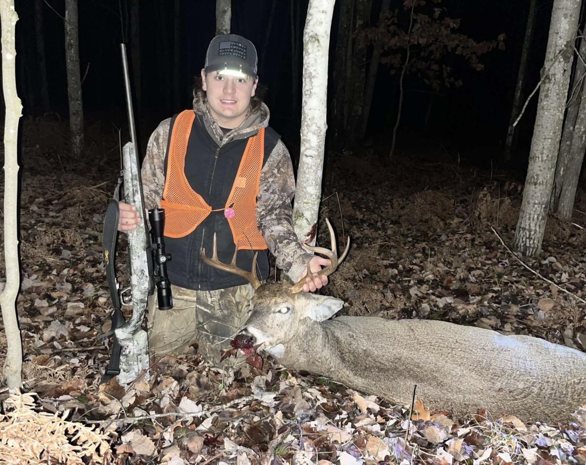 Junior Jackson Shattuck takes a picture with his deer. 