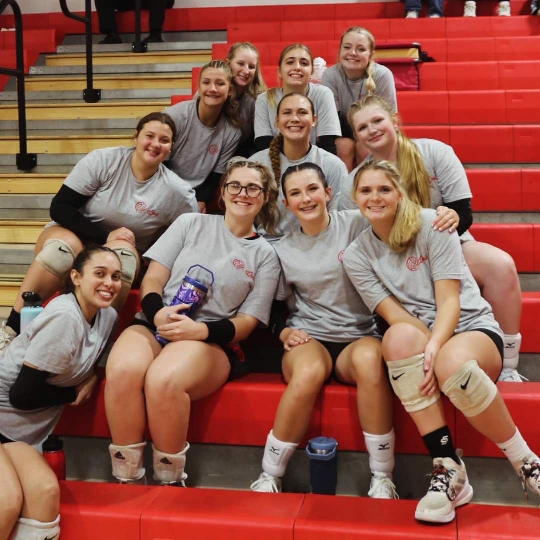 The varsity team takes a photo together before a game.