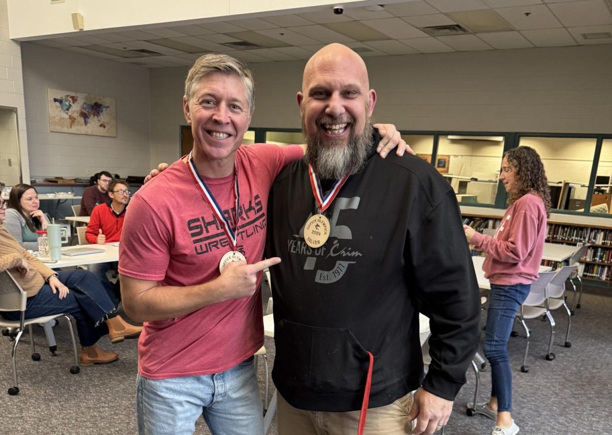 Teachers Mr. Kuhn and Mr. Maxwell show off their brand new medals!