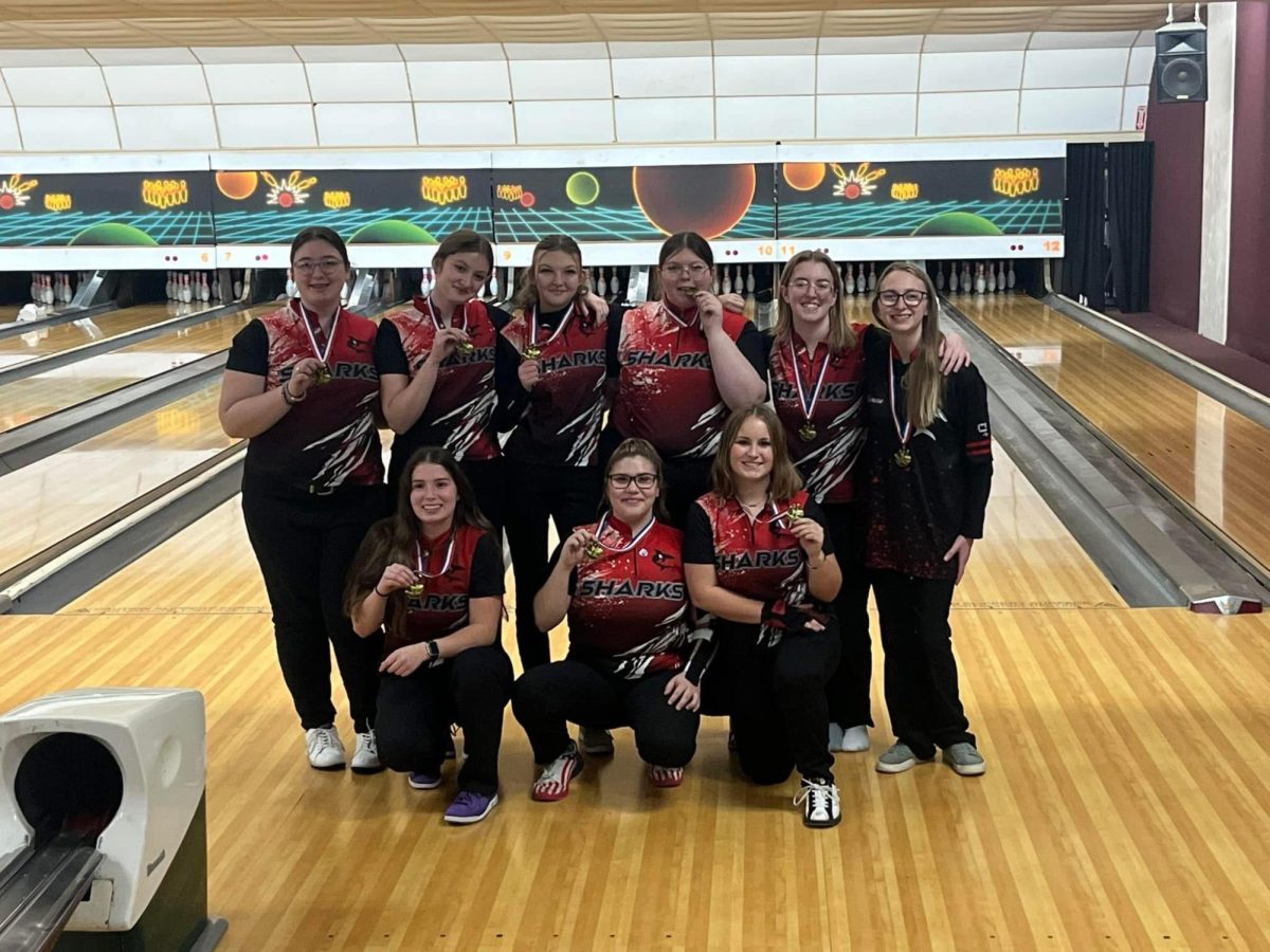 The girls Varsity team with their medals