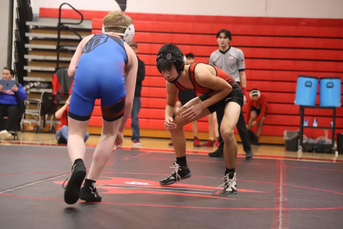 Rudy Clapp faces off against his opponent, eager for victory.