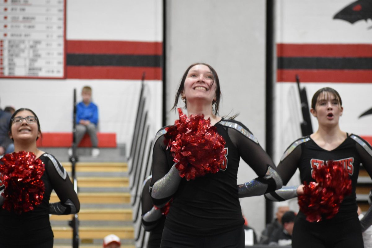 Senior Elizabeth Burt excitedly performs at the wrestling assembly.