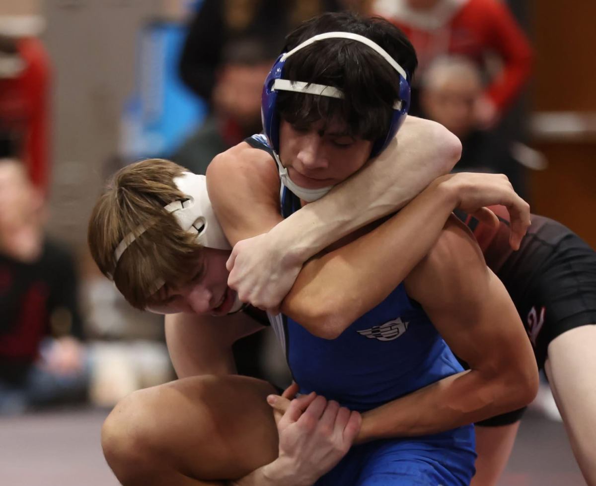 Colin Kuhn fights hard against his opponent.