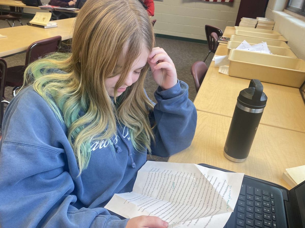 Junior Riley Isham studies hard on her review.