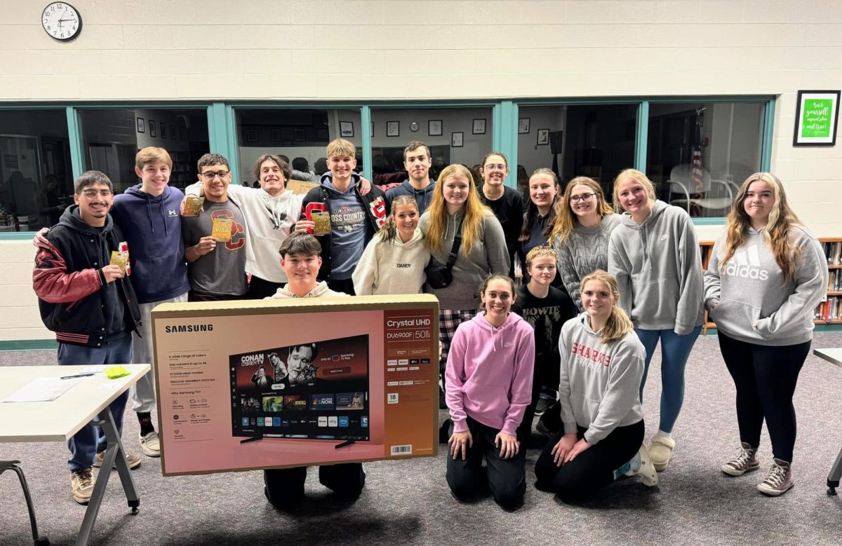 Senior attendees take a photo together after a successful Financial Aid Night.