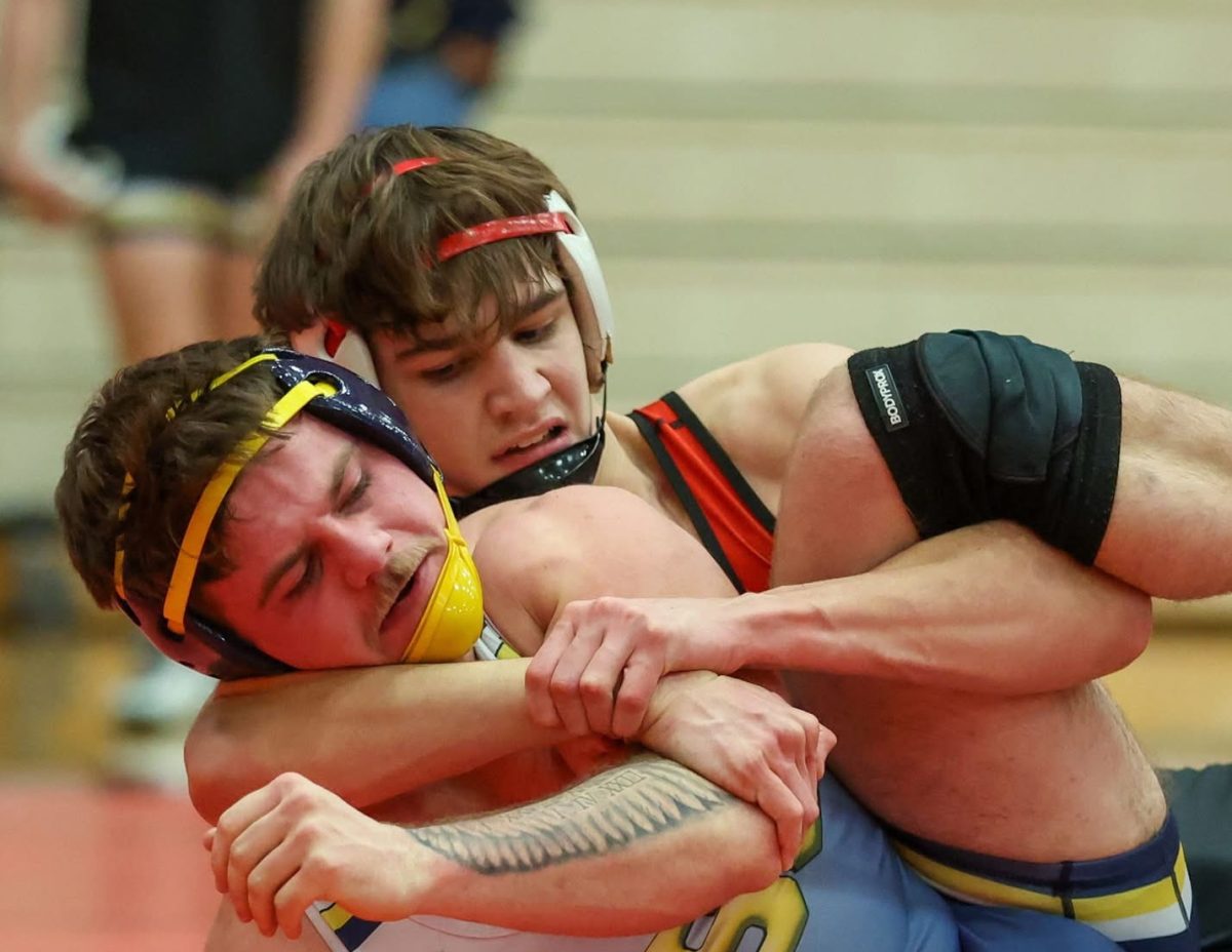 Drew Challender fights hard against his opponent.