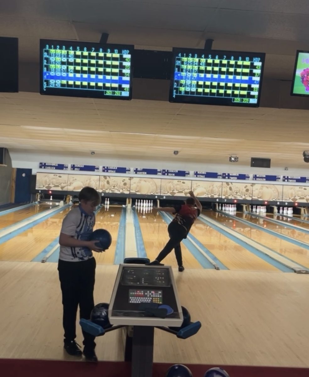 Sophomore Merrick Bartlett releases the ball down the lane in hopes of getting a strike.