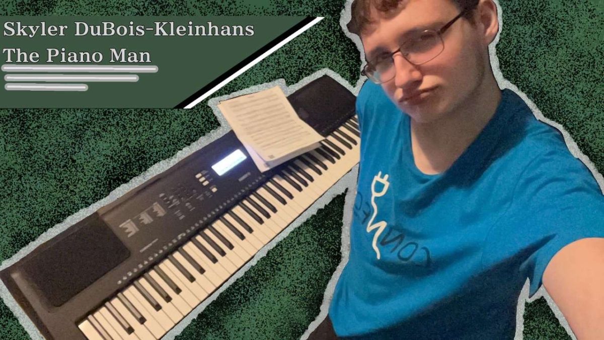 Skylar DuBois-Kleinhans takes a photo with his beloved keyboard.