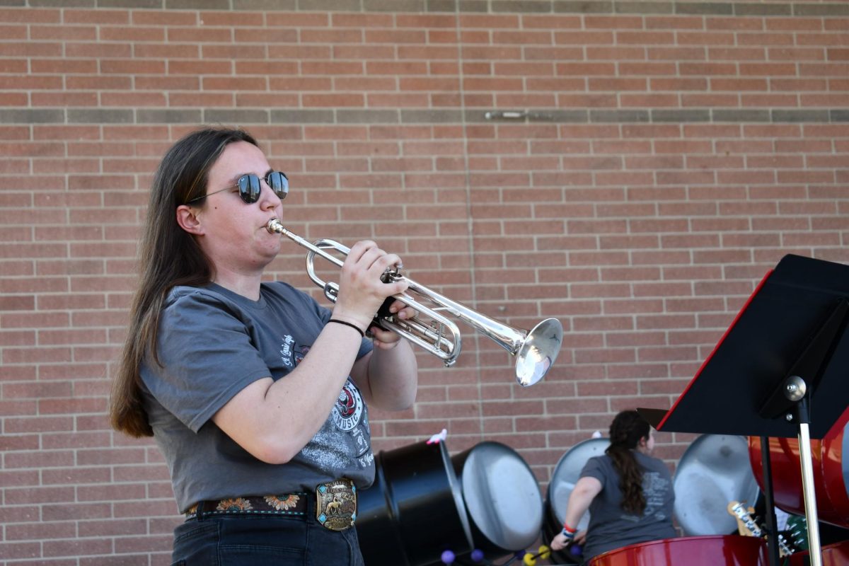 Senior Rebekah Ross plays a trumpet solo during the steel band performance.