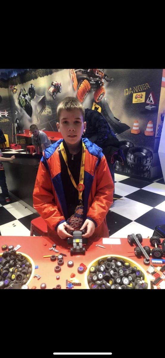 A young Bryan Wing builds LEGOs.