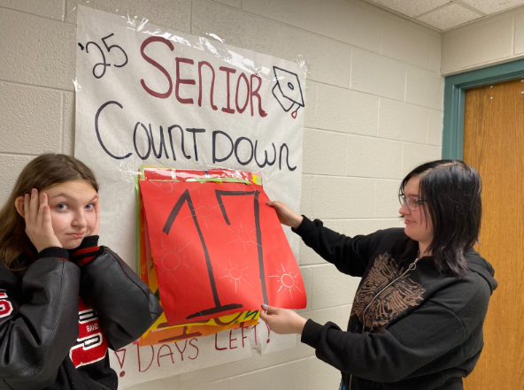 Two seniors look at the countdown until their last day of high school.