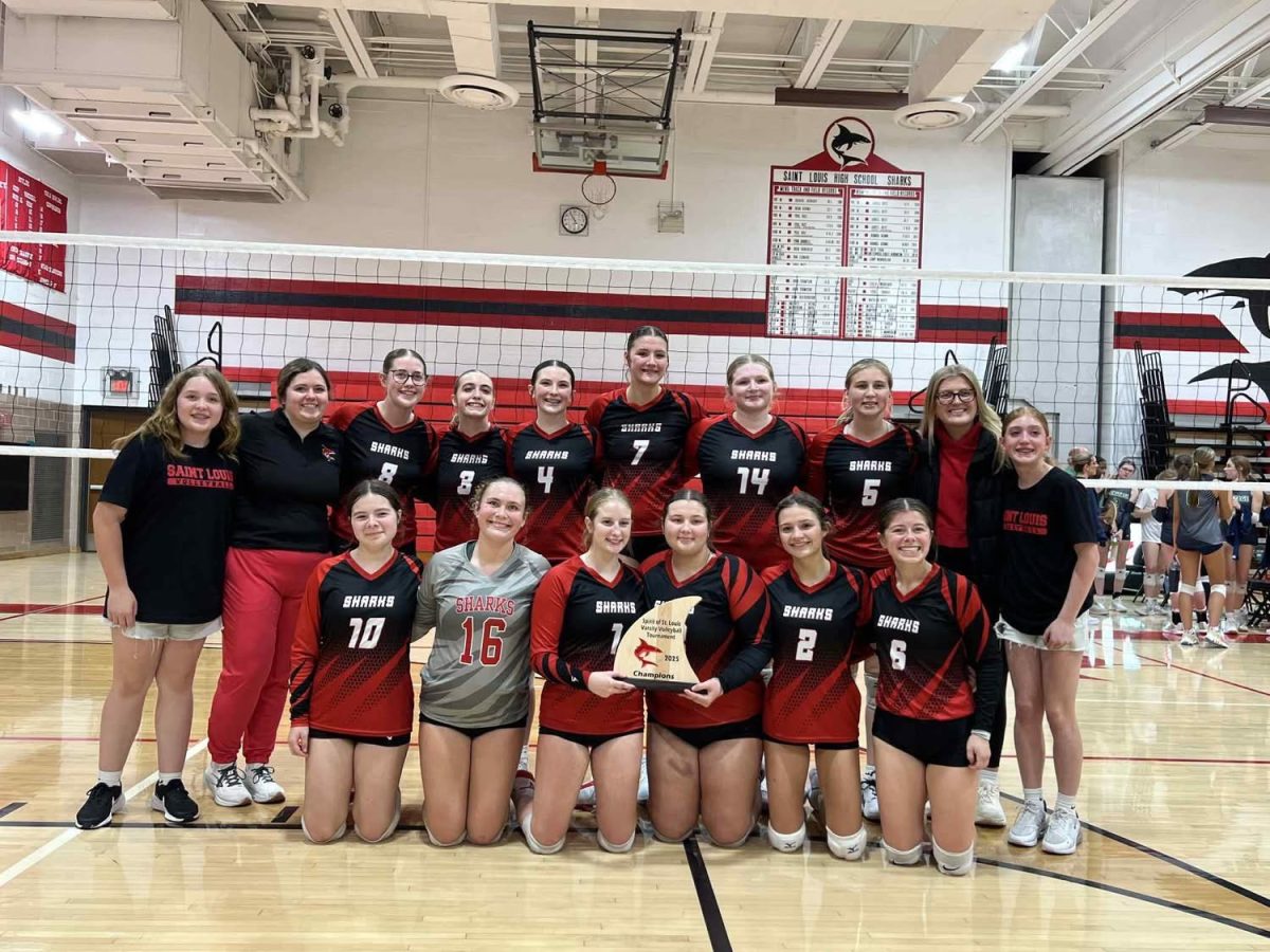 The Volleyball team gather for a photo after their win!