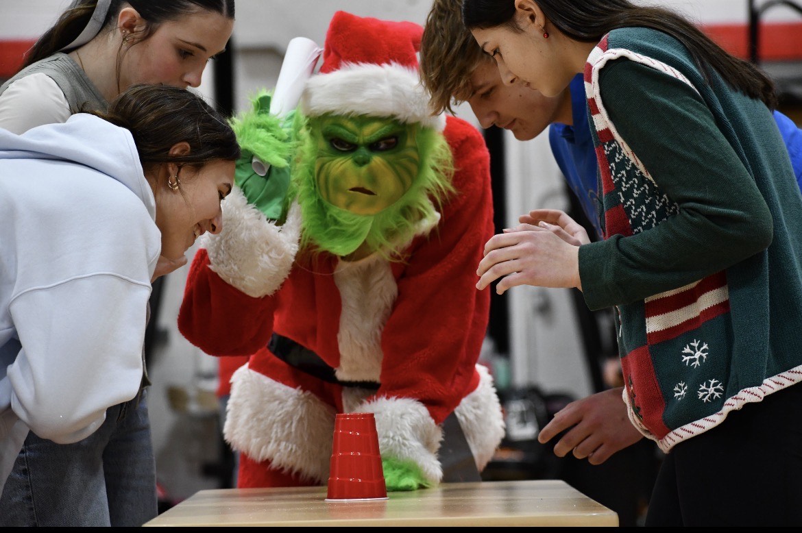 Students and the Grinch prepare for a game!